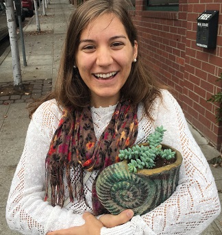 Picture of Kelly Sullivan holding succulent plant