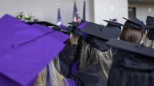 graduating with graduation caps