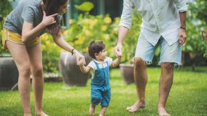 parents going on a walk with there toddler 