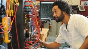 Electro-Mechanical Technology student Gilbert Cooksey analyzes some equipment.