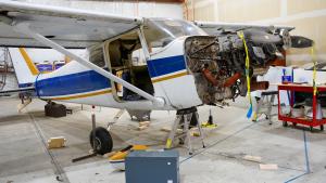 Photo of a small airplane being worked on