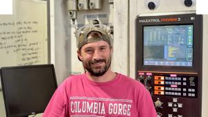 robert-wells clark infront of cnc machine